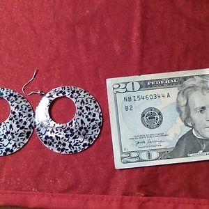 Large floral overlay on shell earrings